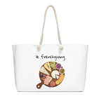 White tote bag with a graphic of a charcuterie board and 'le frenchgiving' text on a white background