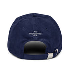 Back view of a rich navy cotton corduroy cap featuring white embroidered text that reads 'The Friendsgiving Club'.